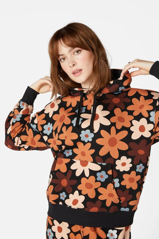 Image of a model wearing Outerwear. Productname: 60S Daisy Floral Track Hoodie in Black colour by brand - Princess Highway
