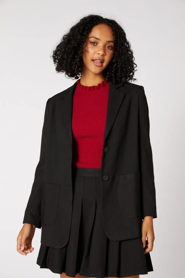 Image of a model wearing Outerwear. Productname: Briony Jacket in Black colour by brand - Princess Highway