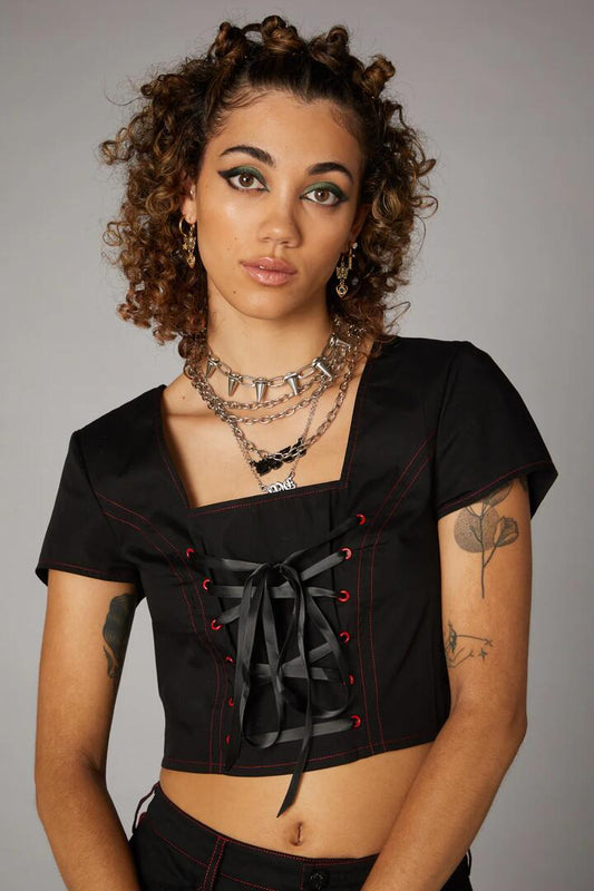 Image of a model wearing Tops. Productname: Contrast StitchCorsetTop in Black colour by brand - Black Friday