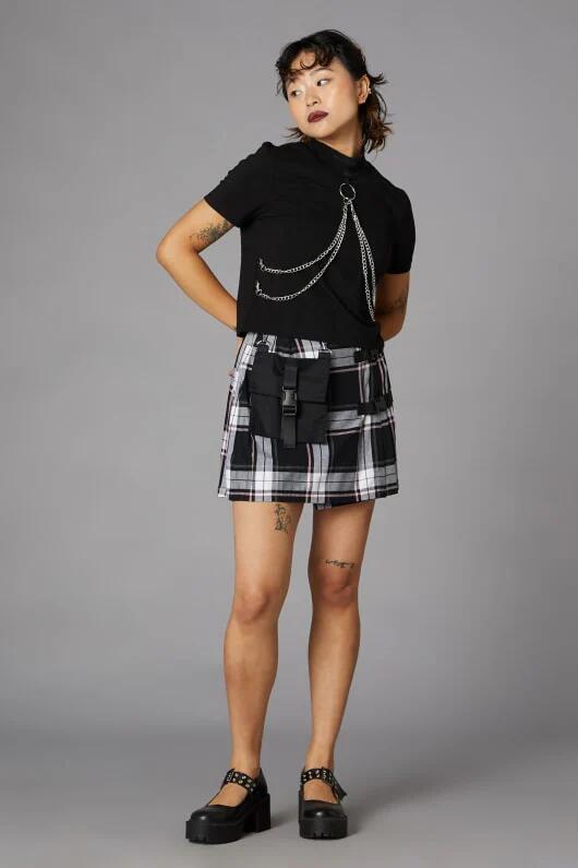 Image of a model wearing Skirts. Productname: Nancy Pink Tartan Mini Skirt in Black/Pink colour by brand - Black Friday