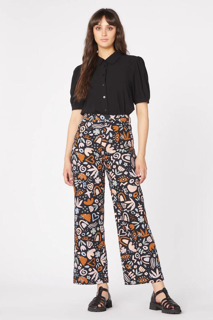 Image of a model wearing Denim. Productname: Arty Geo Printed Jean in Black colour by brand - Princess Highway