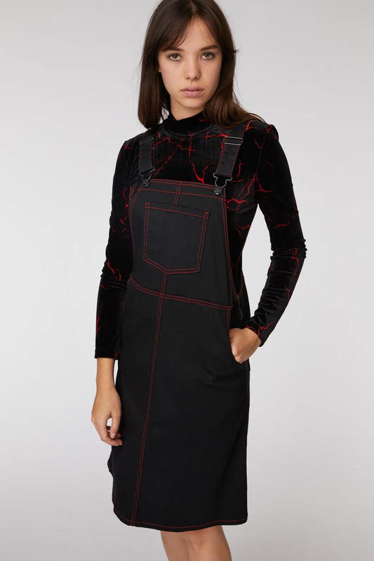 Image of a model wearing Dress. Productname: Welcome To Hell Pinafore in Black colour by brand - Black Friday