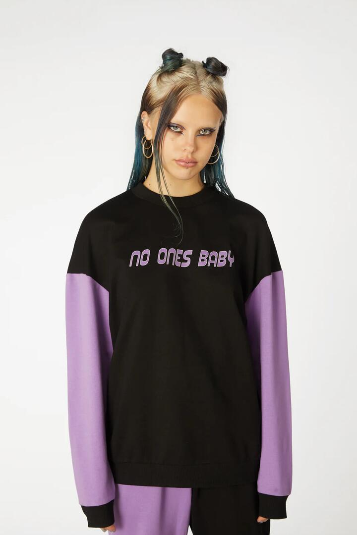 Image of a model wearing Outerwear. Productname: Colour BlockPrintSweater in Black/Purple colour by brand - Black Friday