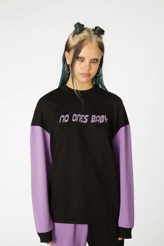 Image of a model wearing Outerwear. Productname: Colour BlockPrintSweater in Black/Purple colour by brand - Black Friday