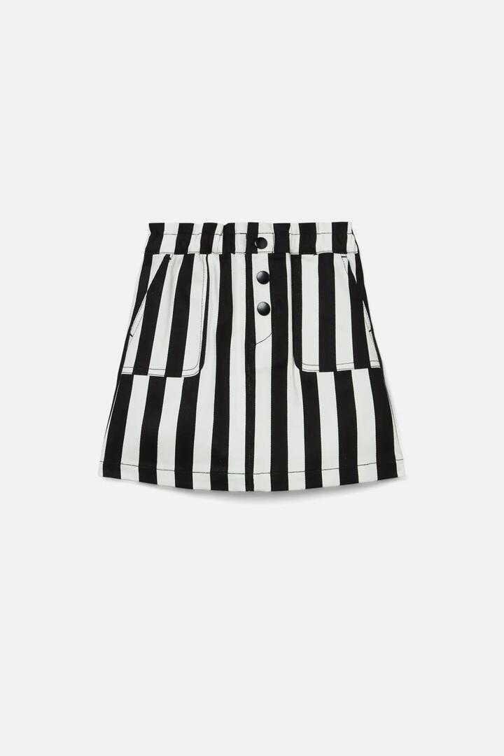 Image of a model wearing Skirts. Productname: Amy Kids Skirt in Black/White colour by brand - Dangerkids