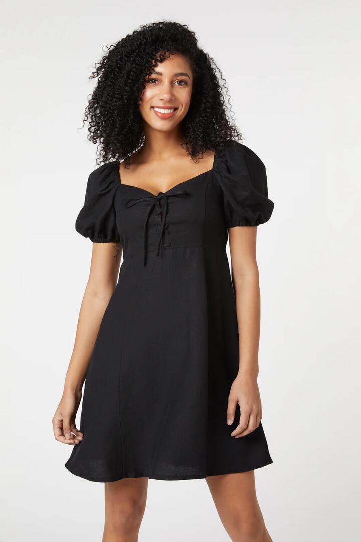 Image of a model wearing Dress. Productname: Leah Lace Up Dress in Raspberry colour by brand - Princess Highway