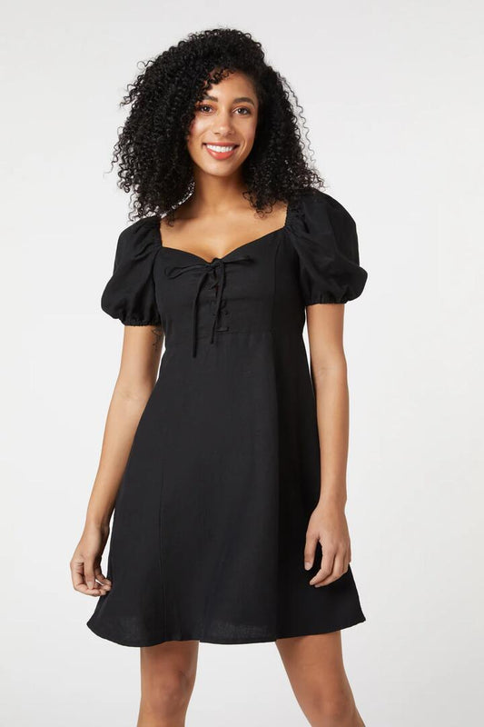 Image of a model wearing Dress. Productname: Leah Lace Up Dress in Raspberry colour by brand - Princess Highway