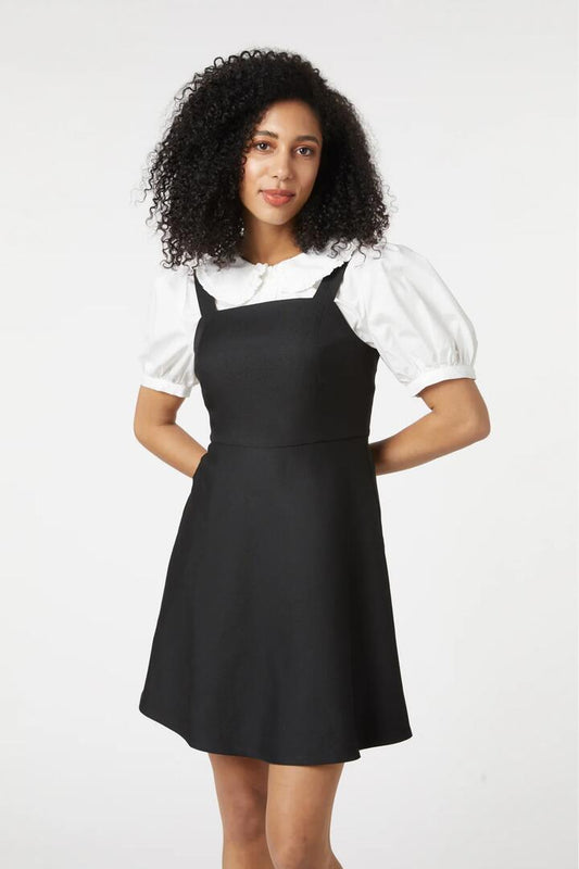 Image of a model wearing Dress. Productname: Ebony Pinny in Black colour by brand - Princess Highway