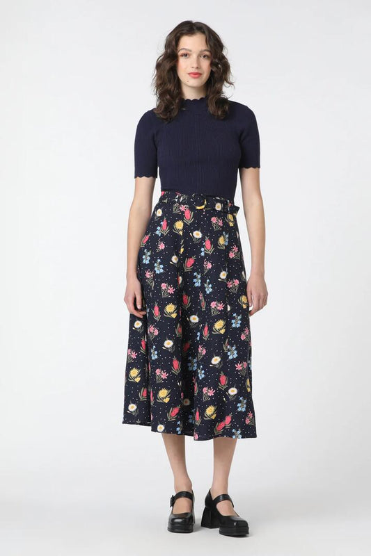 Image of a model wearing Skirts. Productname: Mia Flora Skirt in Navy colour by brand - Princess Highway