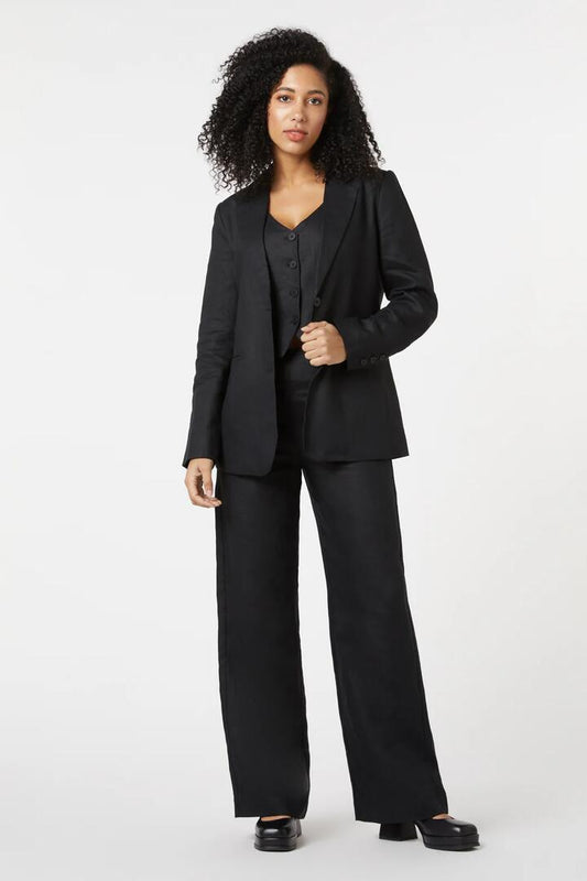 Image of a model wearing Outerwear. Productname: Darcey Linen Blazer in Black colour by brand - Princess Highway