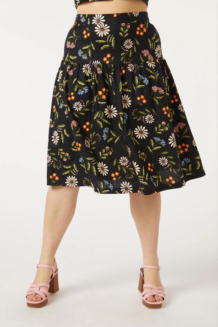 Image of a model wearing Skirts. Productname: Julia Midi Skirt in Black colour by brand - Princess Highway