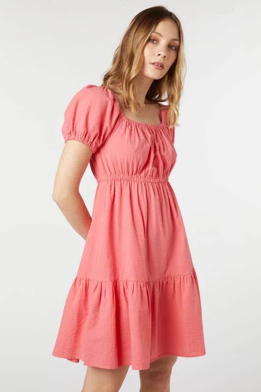 Image of a model wearing Dress. Productname: Belle Mini Dress in Coral colour by brand - Princess Highway