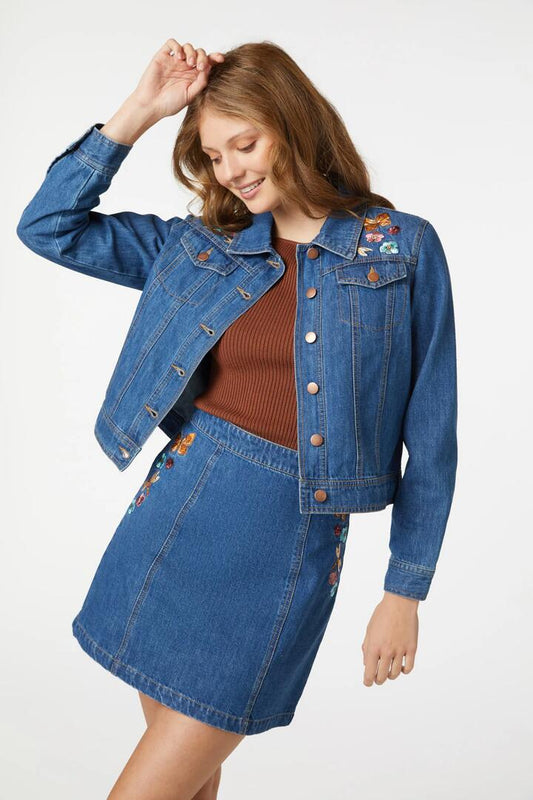 Image of a model wearing Outerwear. Productname: Flora Embroidered Jacket in Mid Denim colour by brand - Princess Highway