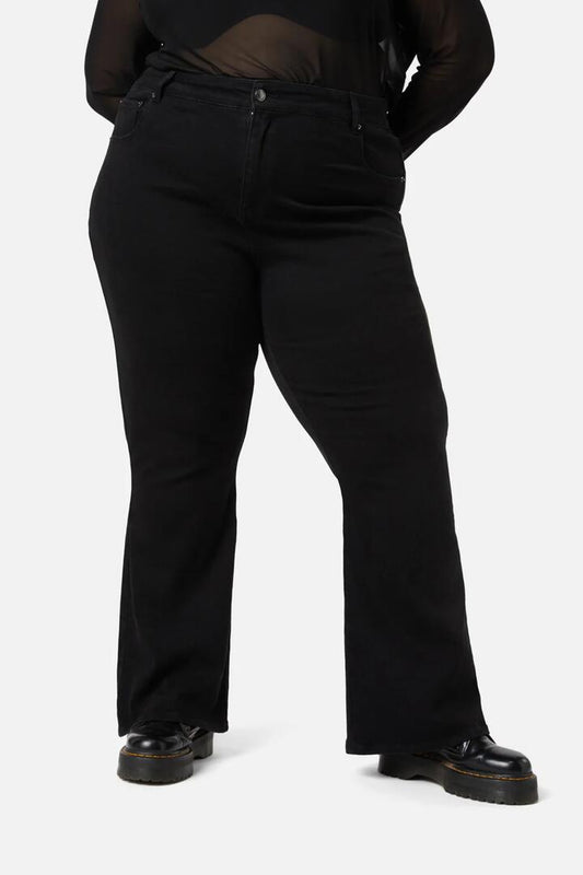 Image of a model wearing Denim. Productname: Lilith Curve Flare Jeans in Black colour by brand - Dangerfield