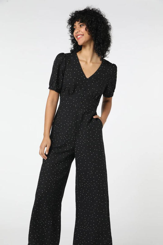 Image of a model wearing Outerwear. Productname: Tia Jumpsuit in Black colour by brand - Princess Highway