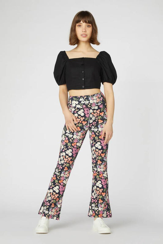 Image of a model wearing Pants. Productname: Natalie Flare Pant in Navy colour by brand - Princess Highway