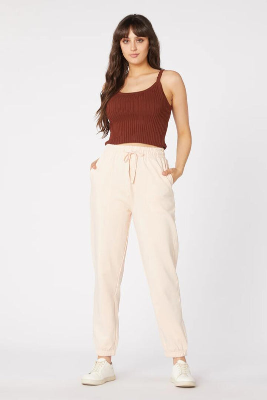 Image of a model wearing Pants. Productname: Giselle Track Pant in Blush colour by brand - Princess Highway