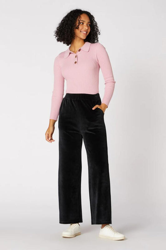 Image of a model wearing Pants. Productname: Harlow Velour Pant in Black colour by brand - Princess Highway