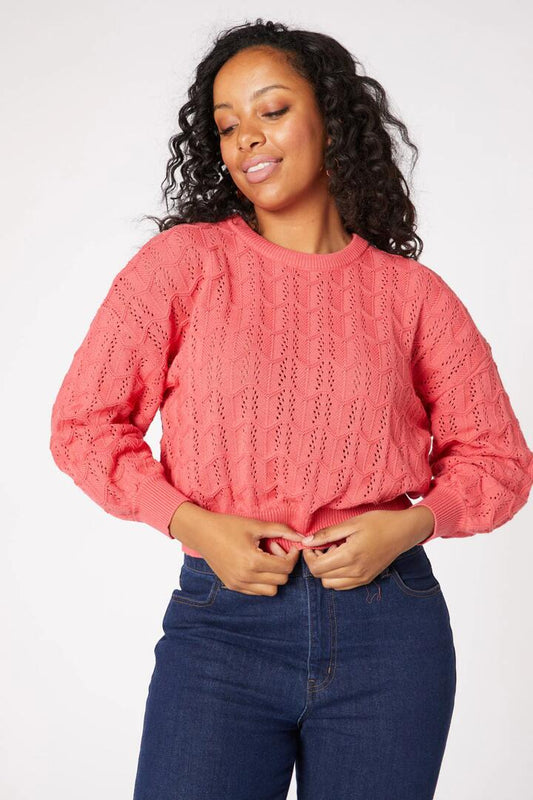 Image of a model wearing Outerwear. Productname: Gracey Sweater in Watermelon colour by brand - Princess Highway
