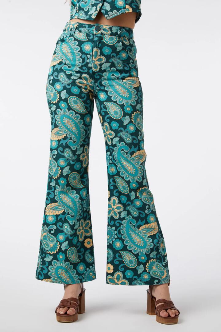 Image of a model wearing Denim. Productname: Sunset Paisley Flare Jean in Green colour by brand - Princess Highway