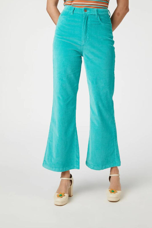 Image of a model wearing Denim. Productname: Indy Flare Jean in Green colour by brand - Princess Highway