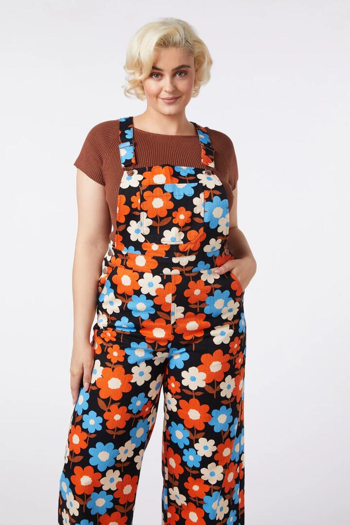 Image of a model wearing Pants. Productname: Renee Floral Overall in Black colour by brand - Princess Highway