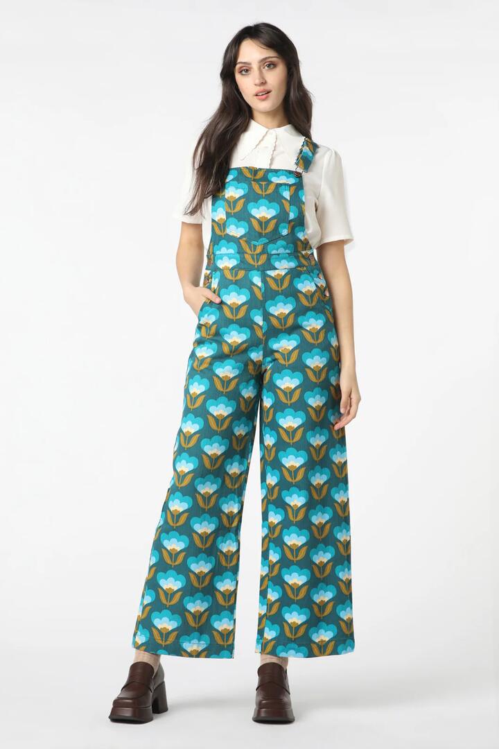 Image of a model wearing Pants. Productname: 70S Wallpaper Overall in Teal colour by brand - Princess Highway