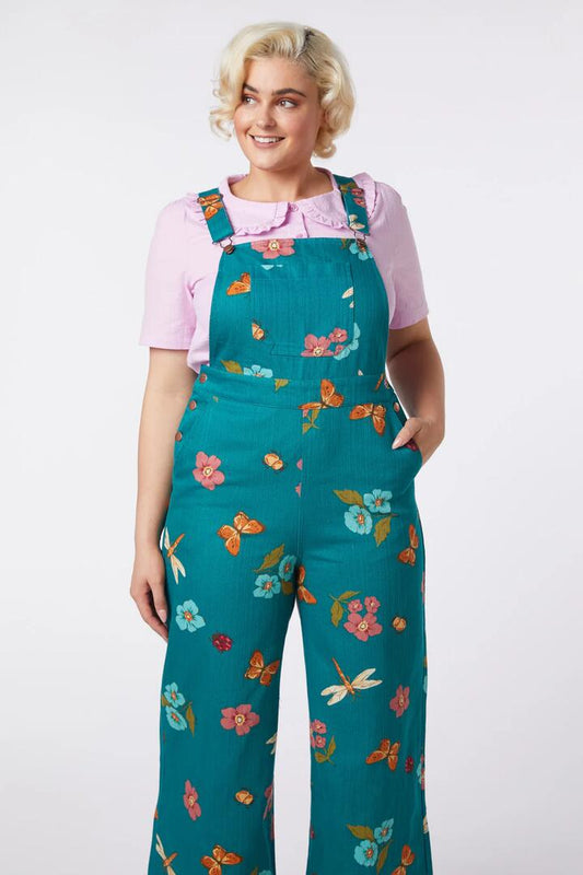 Image of a model wearing Pants. Productname: Serena Flora Overalls in Teal colour by brand - Princess Highway