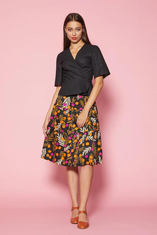 Image of a model wearing Tops. Productname: Joy Wrap Top in Black colour by brand - Princess Highway