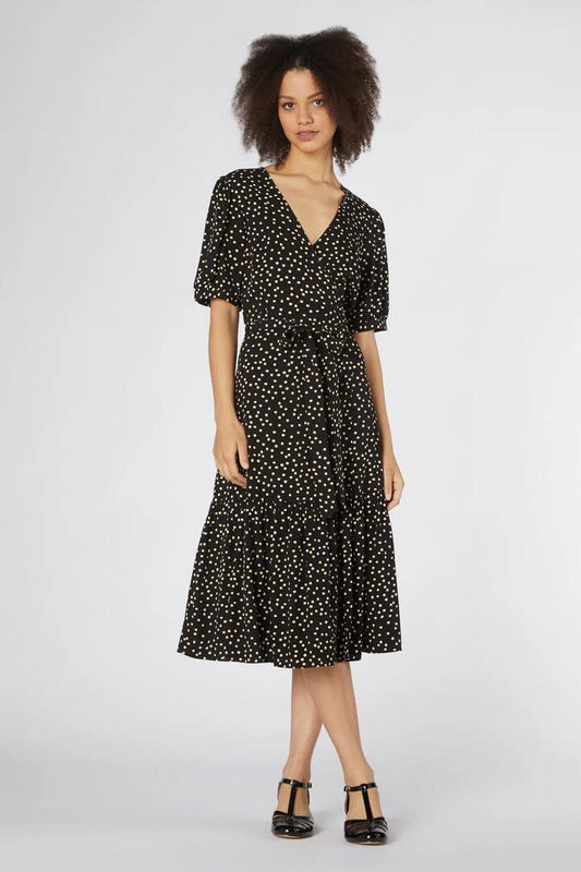Image of a model wearing Dress. Productname: Olivia Spot Wrap Dress in Black colour by brand - Princess Highway