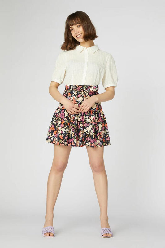 Image of a model wearing Skirts. Productname: Natalie Flippy Skirt in Navy colour by brand - Princess Highway