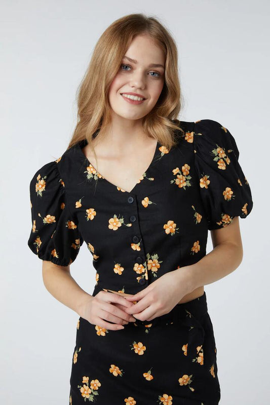 Image of a model wearing Tops. Productname: Bianca Ditsy Blouse in Black colour by brand - Princess Highway