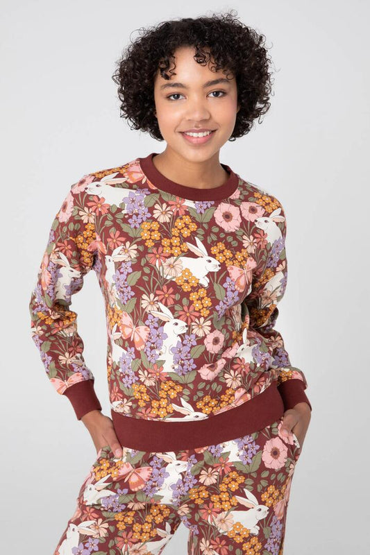 Image of a model wearing Outerwear. Productname: Garden Rabbit Crew Sweater in Chocolate colour by brand - Princess Highway