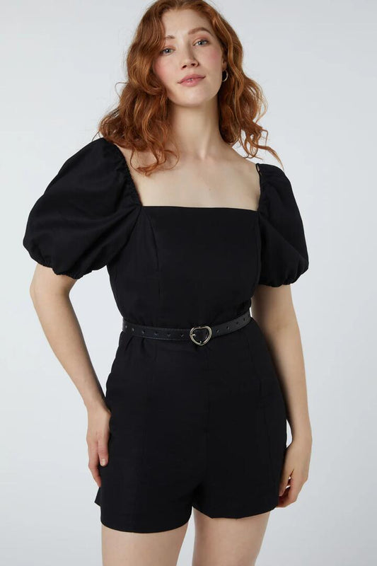Image of a model wearing Dress. Productname: Lillian Playsuit in Black colour by brand - Princess Highway
