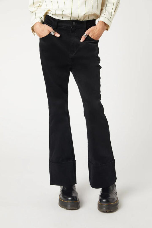 Image of a model wearing Pants. Productname: Ziggy Velvet Pant in Black colour by brand - Dangerfield