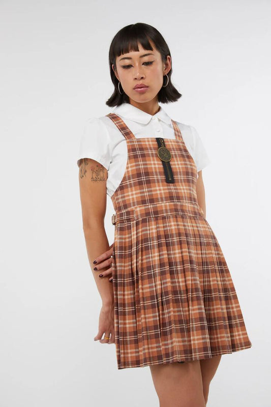 Image of a model wearing Dress. Productname: Looking Glass Tartan Pinafore in Brown colour by brand - Dangerfield