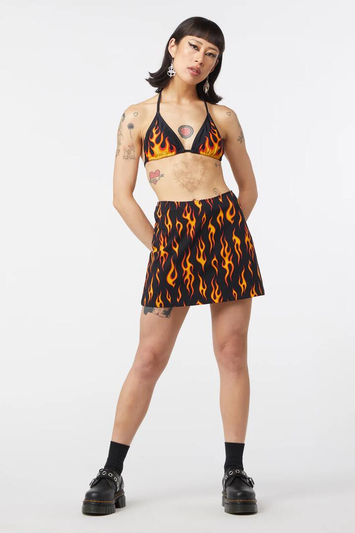 Image of a model wearing Tops. Productname: Inferno Jersey Skort in Black colour by brand - Dangerfield