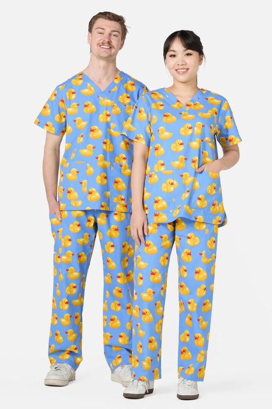 Image of a model wearing Uniforms & Workwear. Product name - Rubber Ducky Scrub in Multi colour by brand - Scrubs With Love