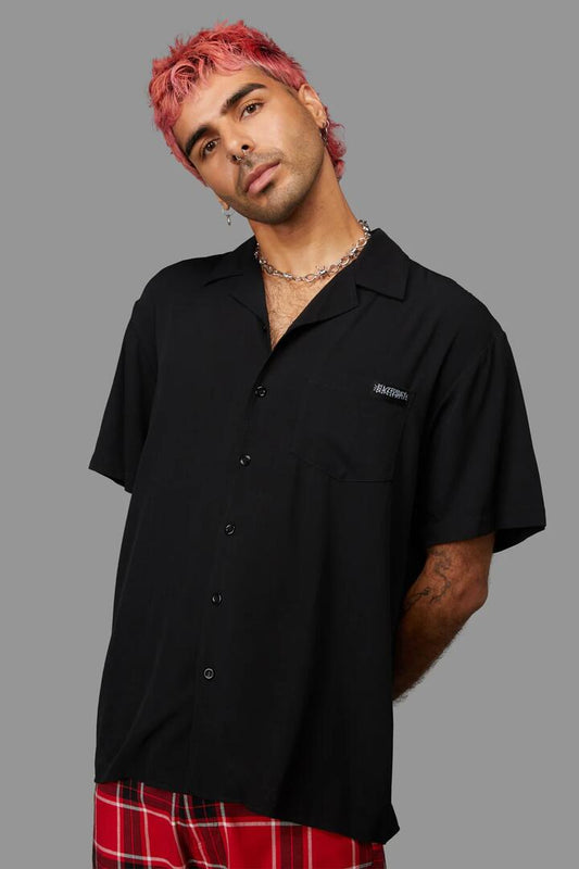 Image of a model wearing Shorts. Productname: Back At It Short Sleeve Shirt in Black colour by brand - Black Friday