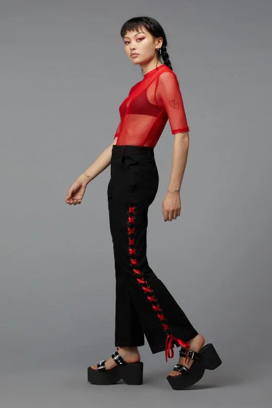 Image of a model wearing Pants. Productname: Laced Ribbon Pant in Black colour by brand - Black Friday