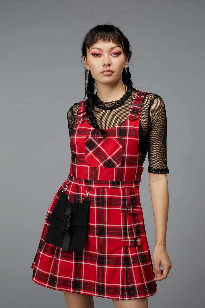 Image of a model wearing Dress. Productname: Demonic Tartan Pinafore in Red colour by brand - Black Friday