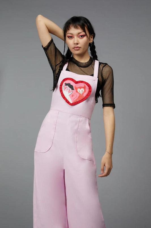 Image of a model wearing Pants. Productname: Love Bug Overall in Pink colour by brand - Black Friday