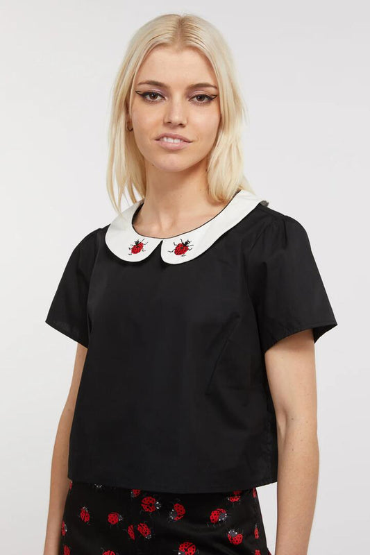 Image of a model wearing Tops. Productname: Collar Ladybug Cotton Blouse in Black colour by brand - Dangerfield