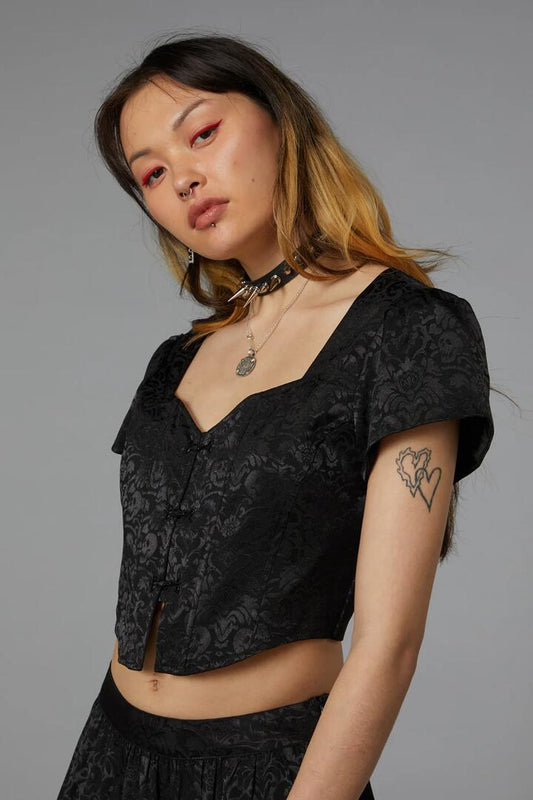 Image of a model wearing Tops. Productname: Midnight Magic Goth Top in Black colour by brand - Black Friday