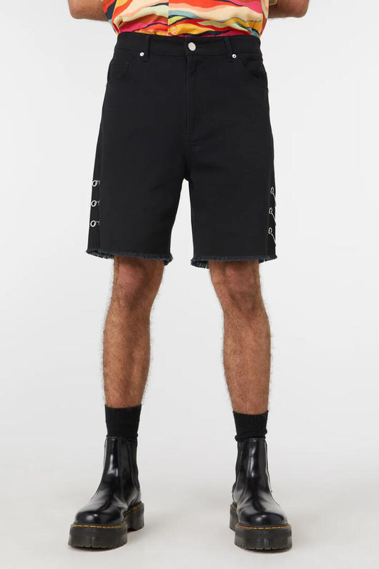 Image of a model wearing Shorts. Productname: Grungy Distressed Short in Black colour by brand - Dangerfield