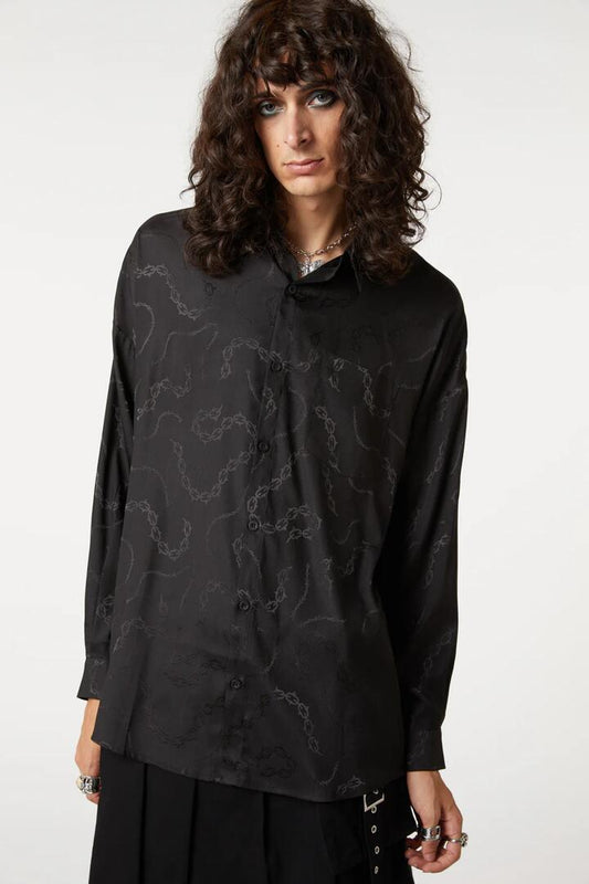Image of a model wearing Tops. Productname: Bound & Chained Satin Long Sleeve Shirt in Black colour by brand - Dangerfield