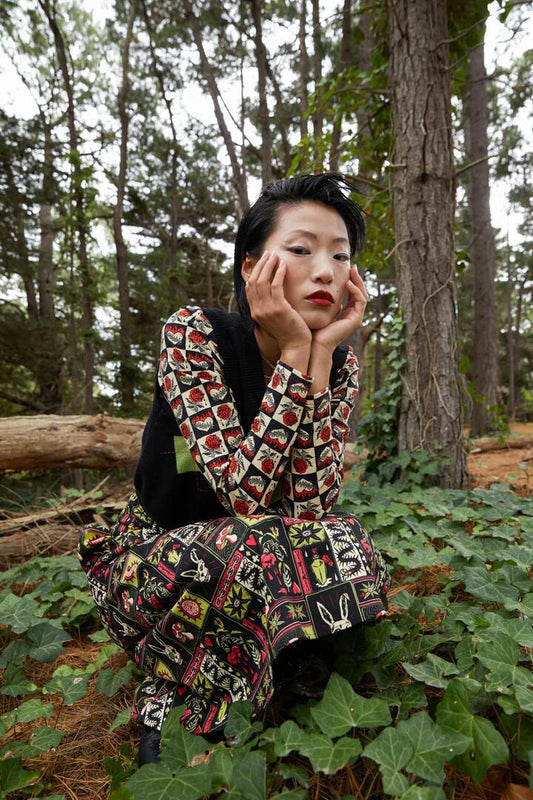 Image of a model wearing Tops. Productname: Knave Of Hearts Cropped Long Sleeve Tee in Black colour by brand - Dangerfield