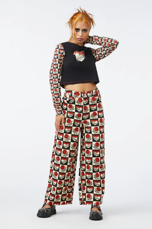 Image of a model wearing Pants. Productname: Guilded Heart & Rose Pant in Multi colour by brand - Dangerfield