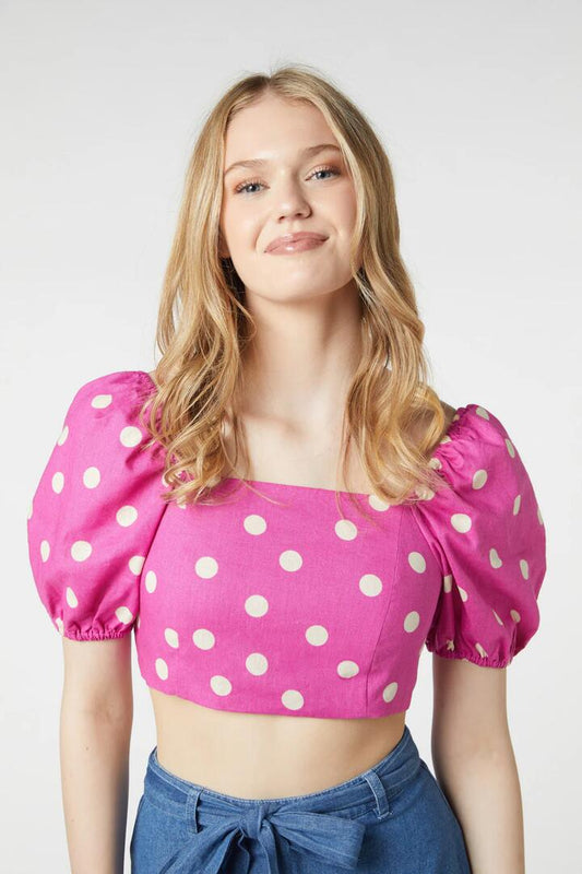 Image of a model wearing Tops. Productname: Lucy Polka Dot Crop Top in Pink colour by brand - Princess Highway