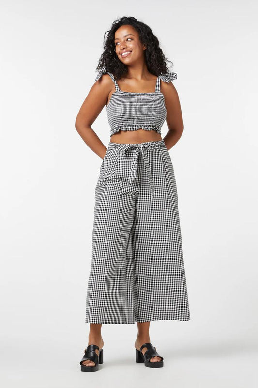 Image of a model wearing Pants. Productname: Tessa Check Pant in Black colour by brand - Princess Highway